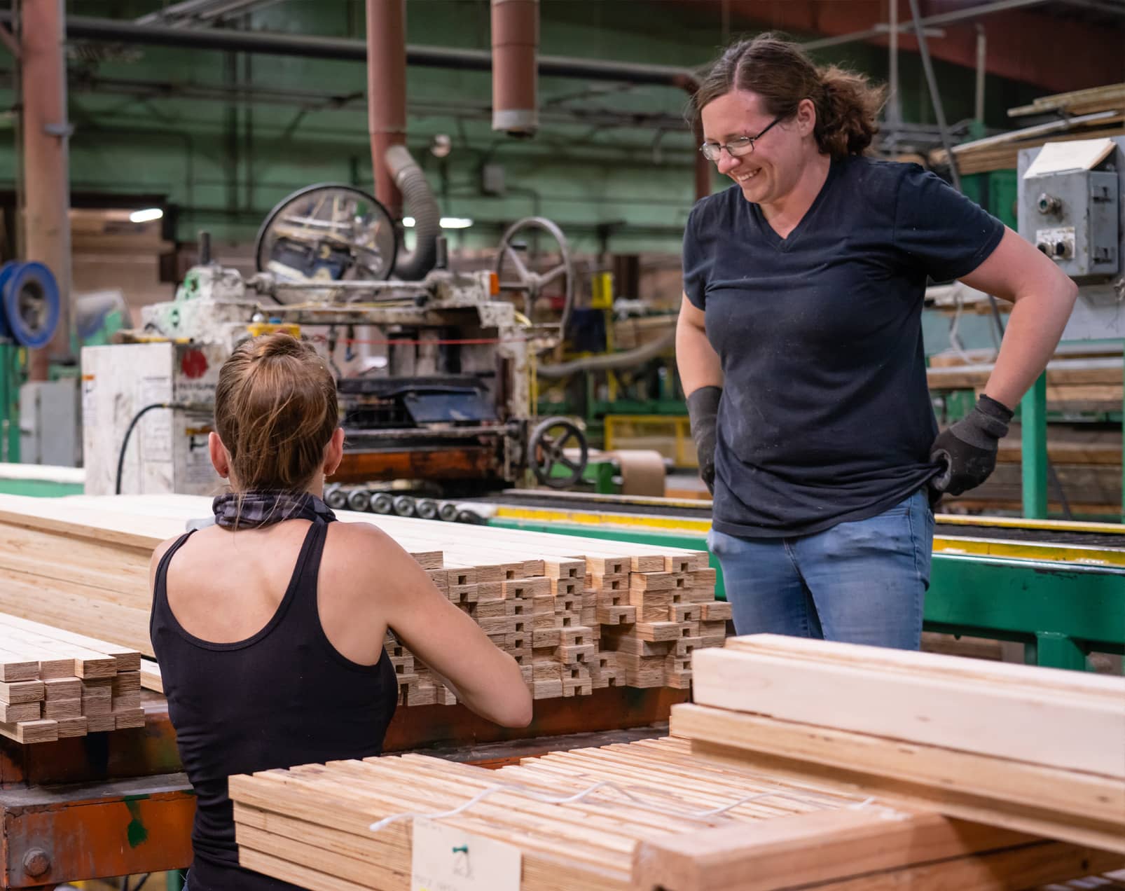 A photo of two South Coast Lumber employees working in the factory