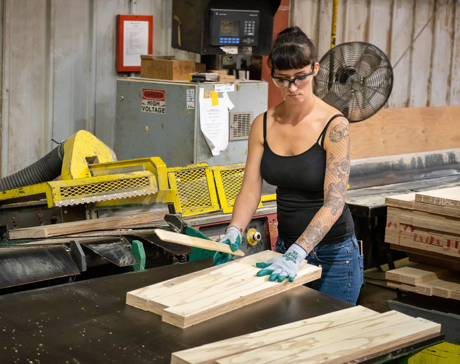 A South Coast Lumber employee works with pieces of wood