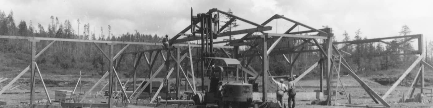 A historical black and white image of the first South Coast Lumber mill